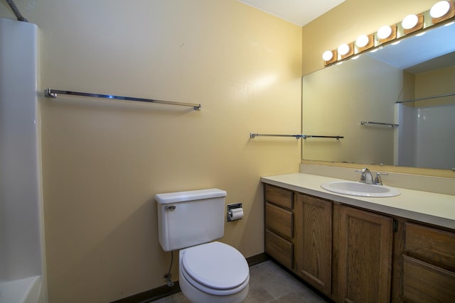 bathroom with vanity, walk in shower, tile patterned floors, and toilet