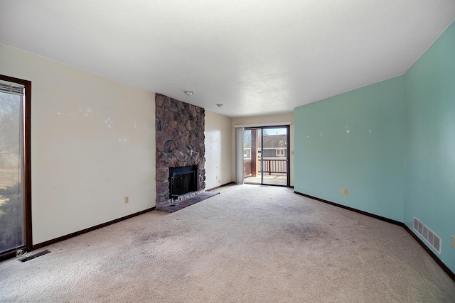 unfurnished living room featuring a fireplace and light carpet