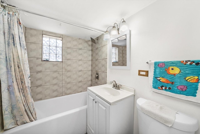 full bathroom featuring vanity, toilet, and shower / tub combo