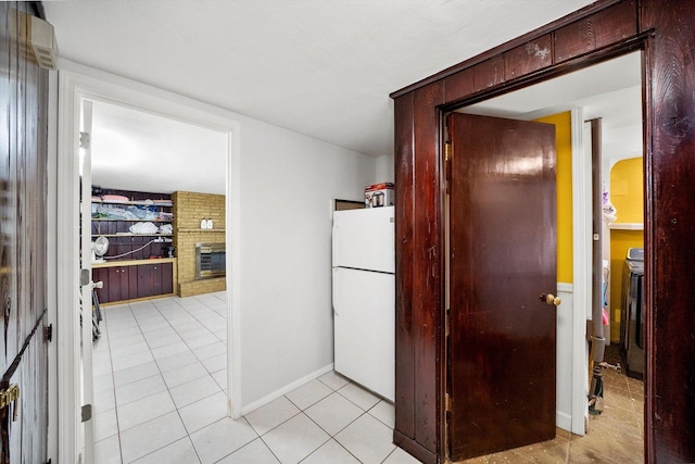 hall featuring light tile patterned floors