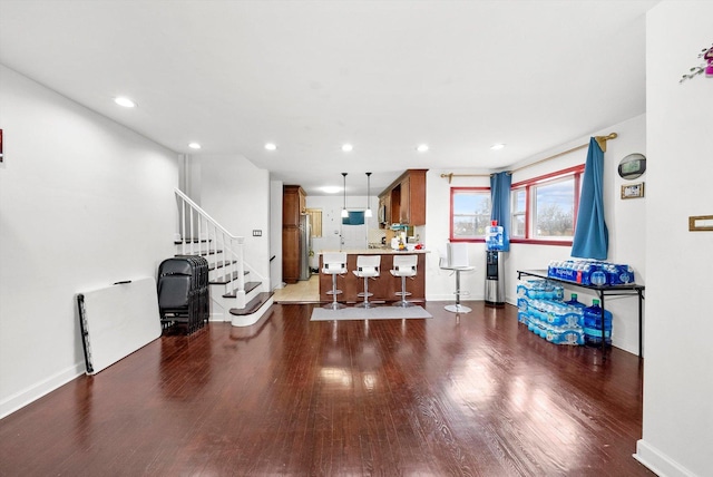 living room with dark hardwood / wood-style flooring