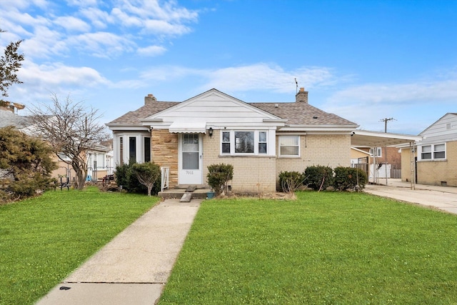 bungalow-style house with a front lawn