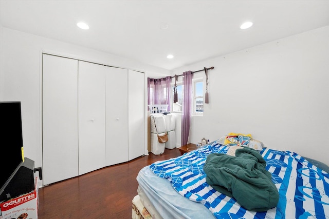 bedroom featuring a closet and dark hardwood / wood-style floors