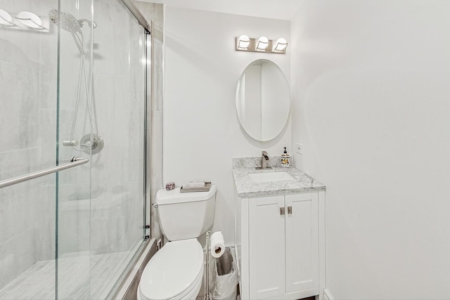 bathroom with vanity, toilet, and walk in shower