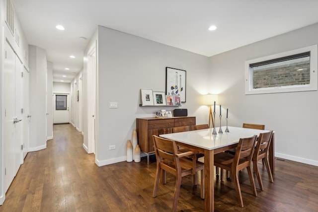 dining space featuring dark hardwood / wood-style flooring