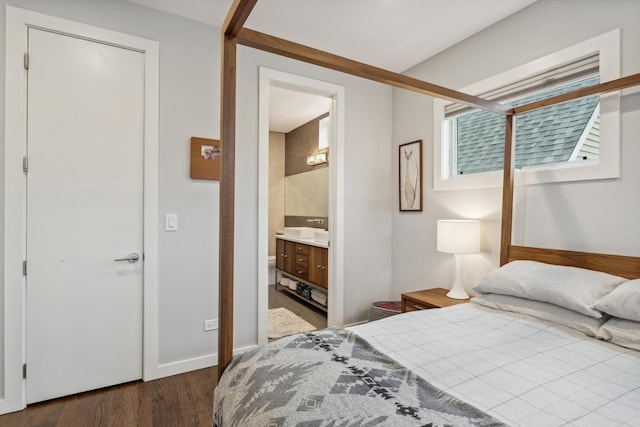 bedroom with dark wood-type flooring and ensuite bath