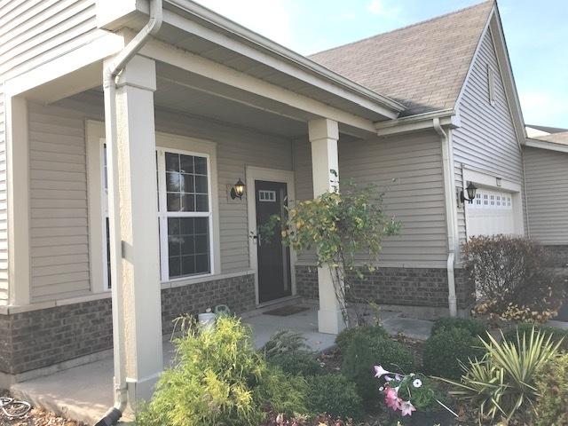 view of exterior entry with a garage