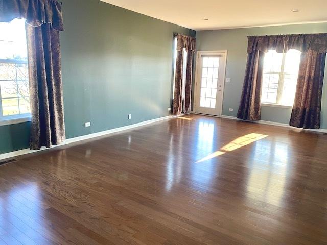 empty room featuring dark hardwood / wood-style floors