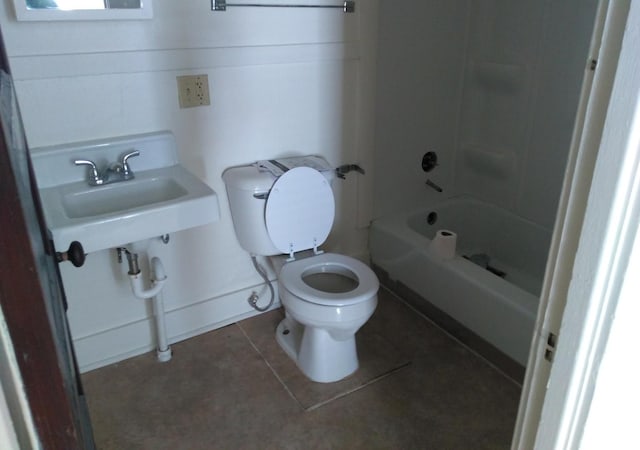 full bathroom with tile patterned flooring, tub / shower combination, sink, and toilet