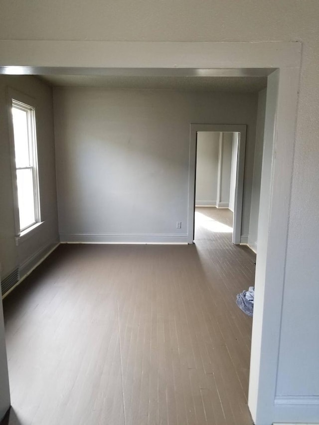 unfurnished room featuring hardwood / wood-style floors