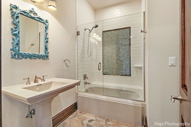 bathroom featuring shower / bath combination with glass door