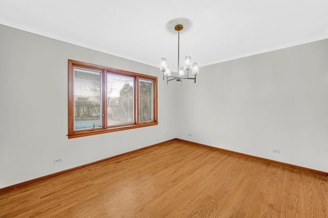 unfurnished dining area featuring ornamental molding, a chandelier, and light wood-type flooring