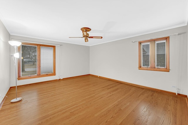 unfurnished room with hardwood / wood-style flooring, crown molding, and ceiling fan