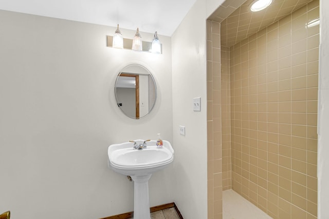 bathroom with tiled shower