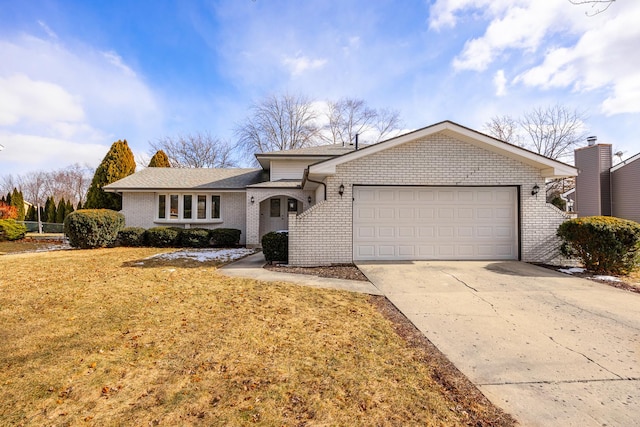 single story home featuring a garage and a front yard