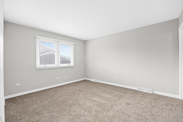 unfurnished room featuring carpet