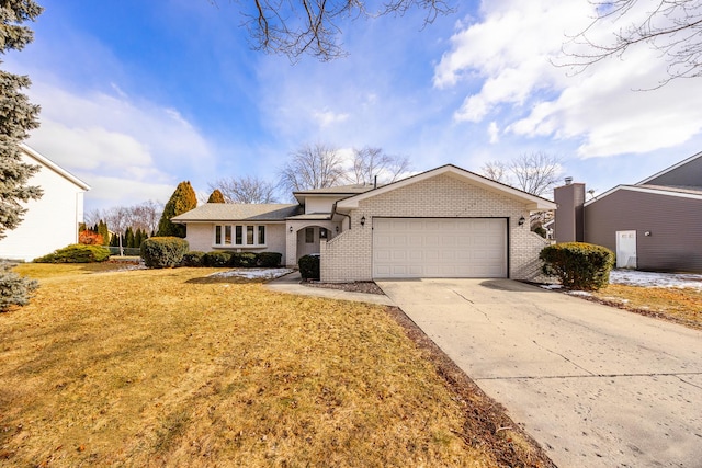 ranch-style home with a garage and a front lawn