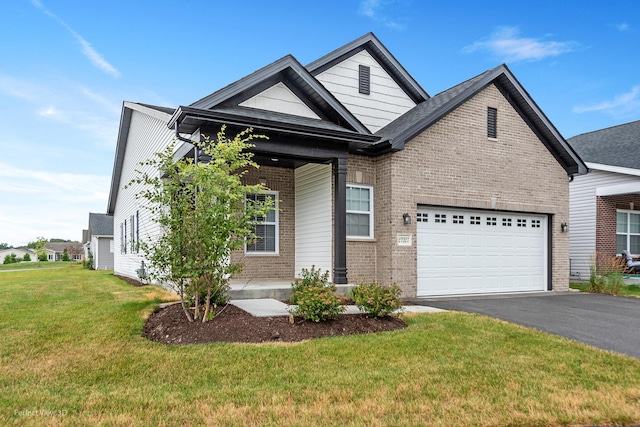 view of front of house featuring an attached garage, driveway, brick siding, and a front yard