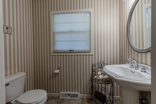 bathroom with tile patterned floors, toilet, and sink