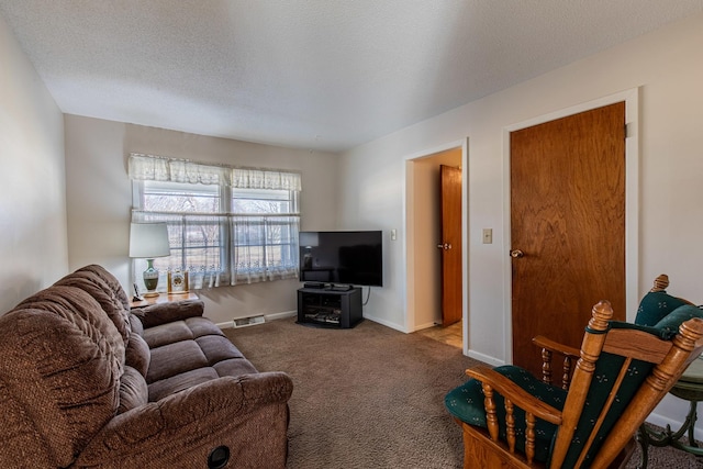 living room featuring light colored carpet and a textured ceiling