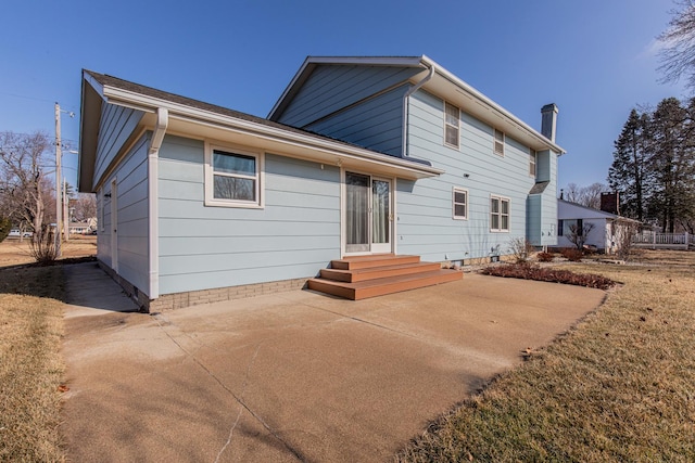 rear view of property featuring a patio area