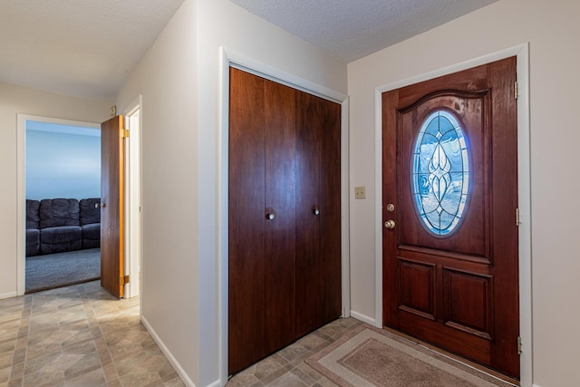 entrance foyer featuring a textured ceiling