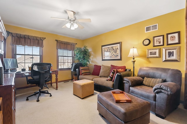 living room featuring ceiling fan and light carpet