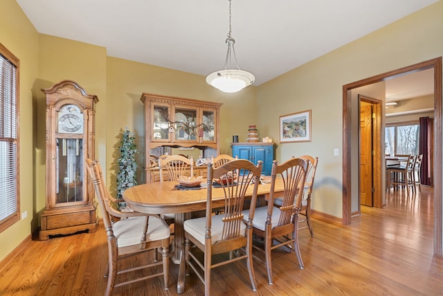 dining area featuring light wood-type flooring