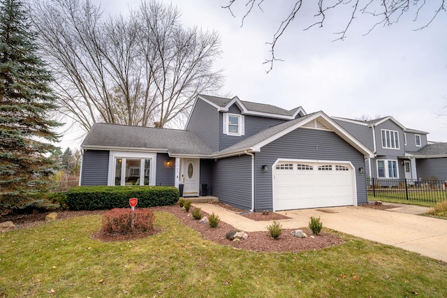 view of front of house with a garage and a front yard