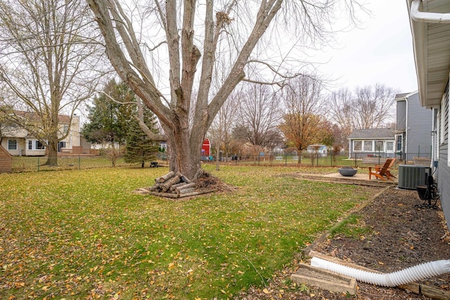 view of yard with central air condition unit