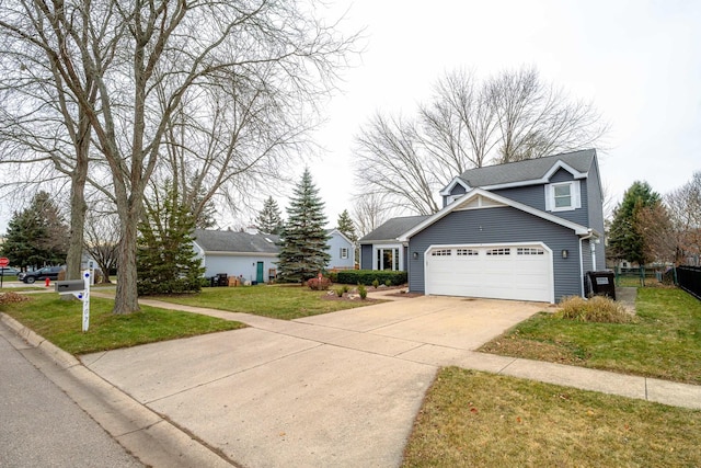 view of front of house with a garage and a front lawn