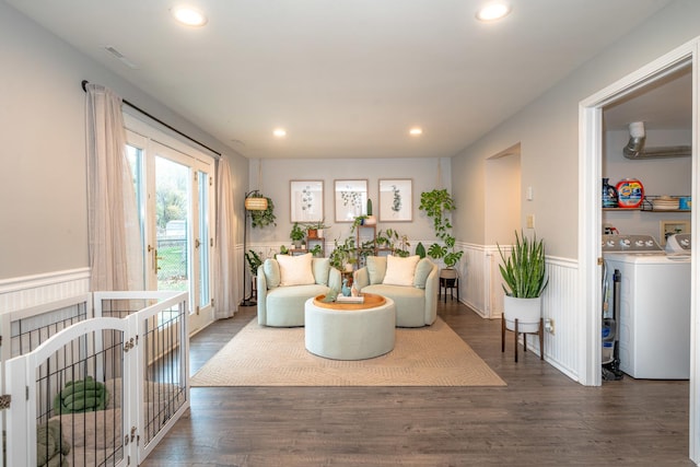 living room with separate washer and dryer and dark hardwood / wood-style flooring