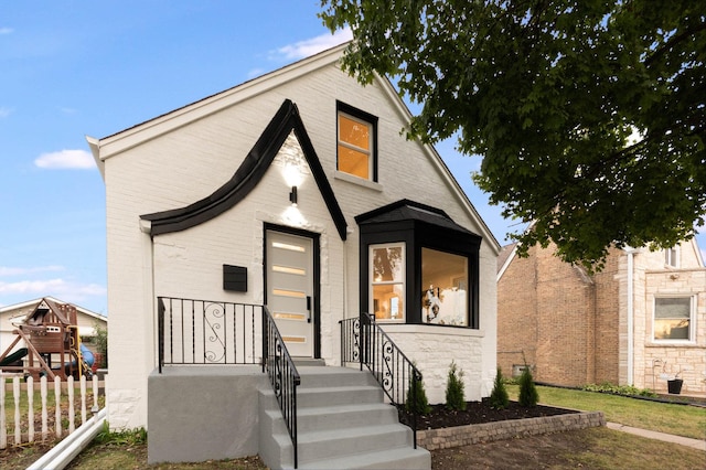 view of front of home featuring a playground