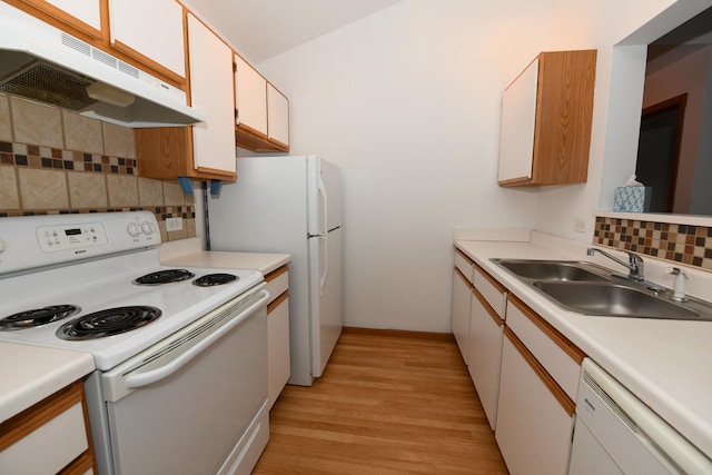 kitchen with sink, white appliances, white cabinetry, backsplash, and light hardwood / wood-style floors