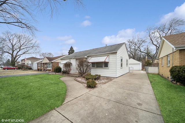 single story home with a garage, an outdoor structure, and a front lawn