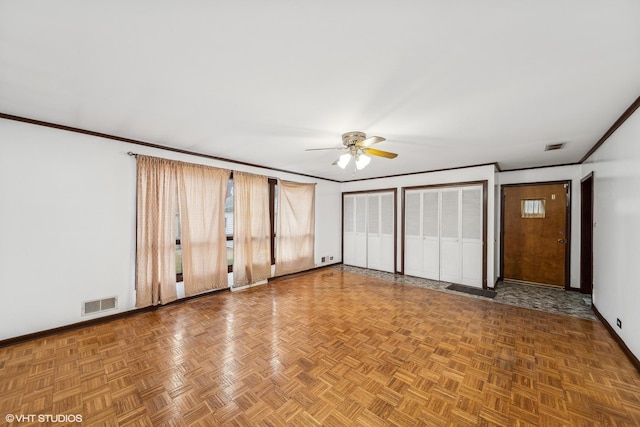 unfurnished bedroom featuring multiple closets, crown molding, parquet floors, and ceiling fan