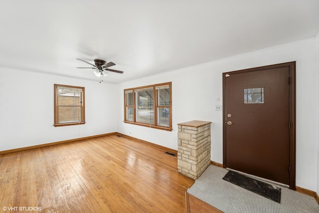 entrance foyer with wood-type flooring and ceiling fan