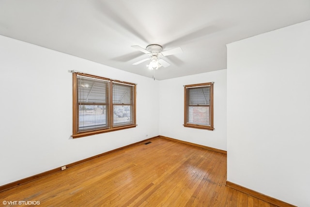 unfurnished room featuring light hardwood / wood-style flooring and ceiling fan