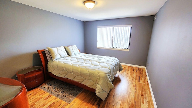 bedroom with light hardwood / wood-style flooring