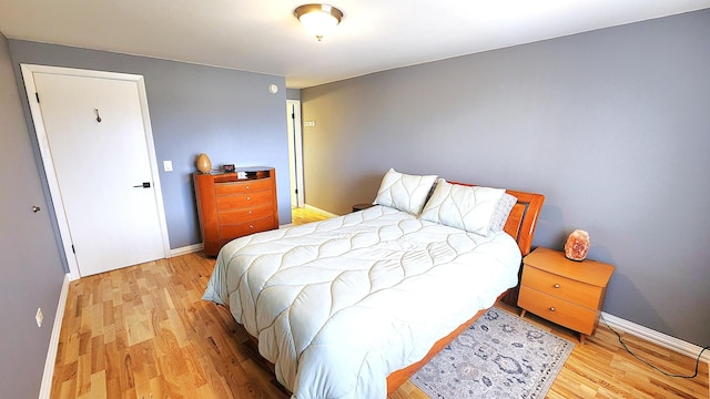 bedroom with light wood-type flooring