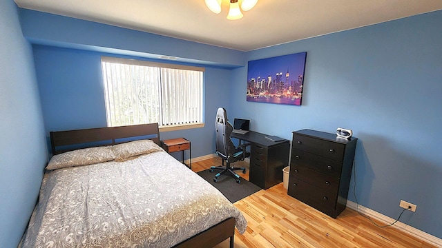 bedroom with light hardwood / wood-style floors