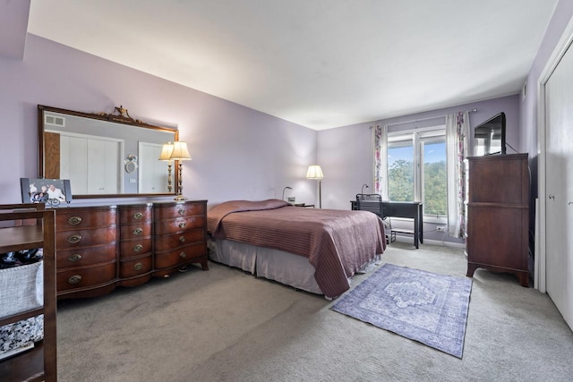 bedroom with light carpet