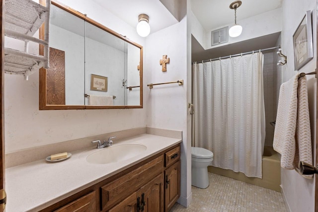 full bathroom with vanity, shower / bath combo, and toilet