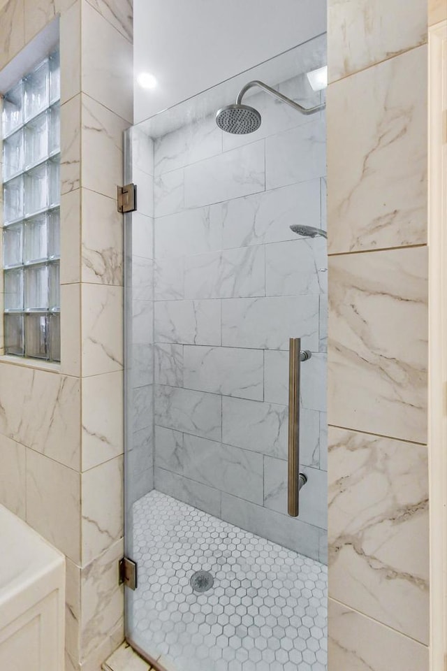 bathroom with an enclosed shower