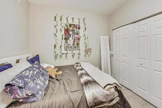 bedroom featuring light hardwood / wood-style floors and a closet