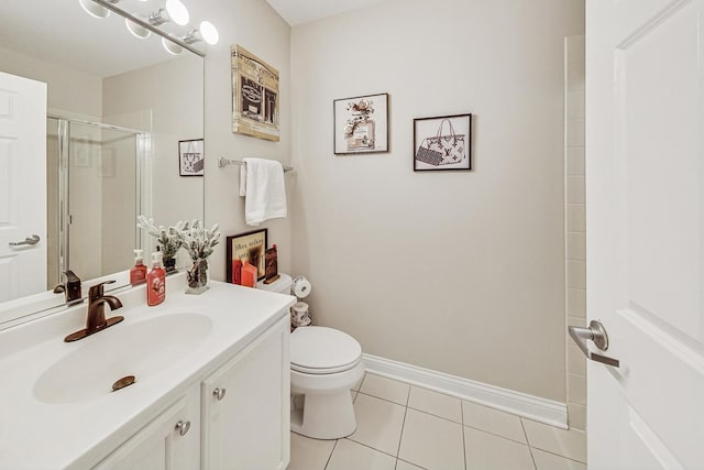 bathroom featuring vanity, toilet, tile patterned flooring, and a shower with door