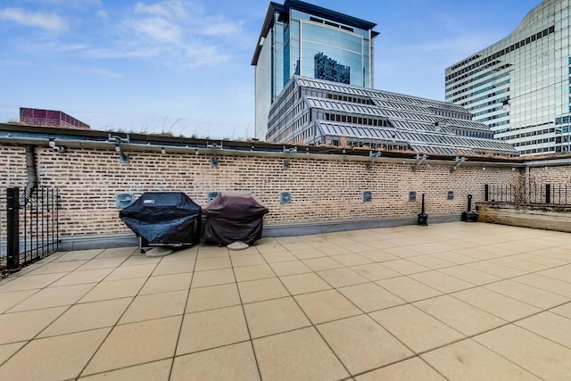 view of patio featuring a grill