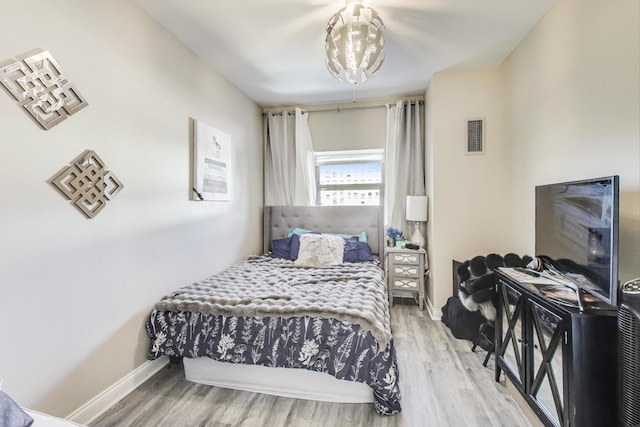 bedroom with hardwood / wood-style floors