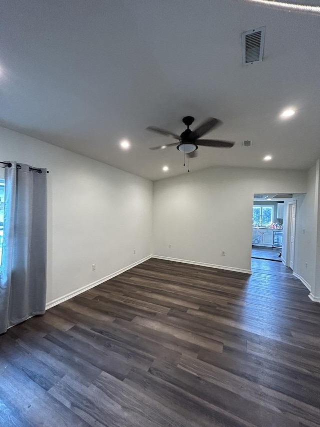 spare room featuring ceiling fan and dark hardwood / wood-style floors