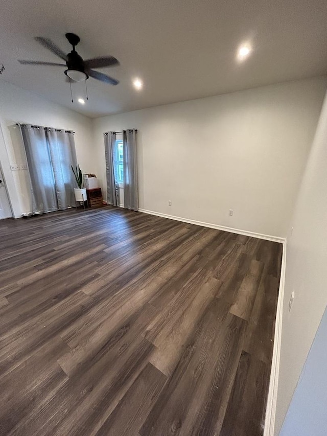 unfurnished room featuring ceiling fan and dark hardwood / wood-style floors